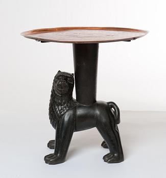 An Anna Petrus table, Sweden early 1920's. Sculptured oak with an engraved copper tray.