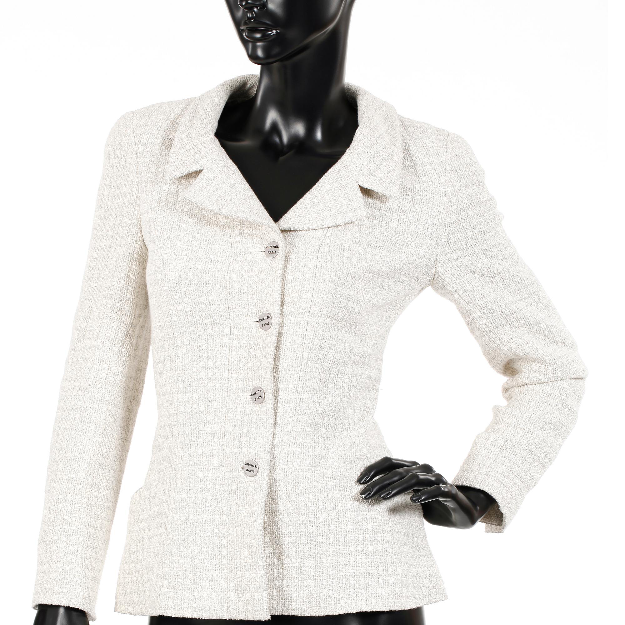 CHANEL, a white bouclé jacket.