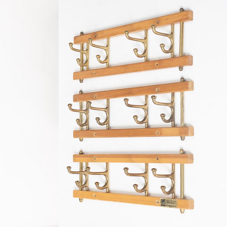 A set of three 'Decorative' coat hangers, Skoglunds metallgjuteri, Anderstorp, 1950s/60s.