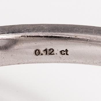 A 14K white gold ring with a topaz and diamonds ca. 0.12 ct in total. Faber art, Helsinki.