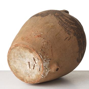 A large teracotta wine jar, Medeterranian area.