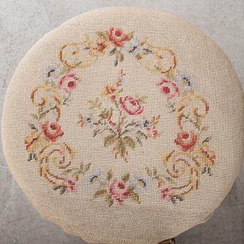 A second half of the 19th century table with mirror and a stool.