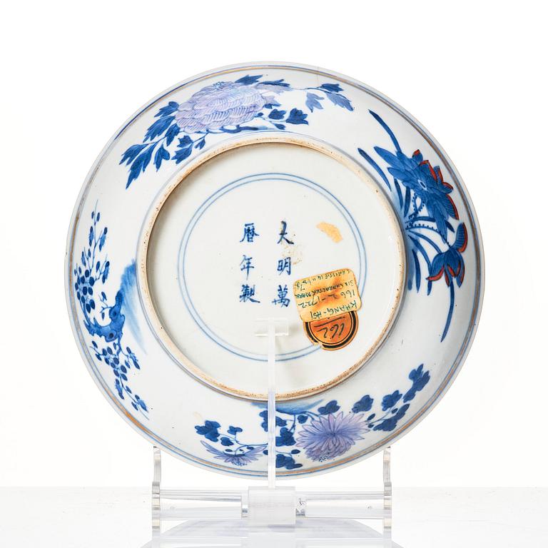 A doucai '100 antiques' dish, Qing dynasty, 18th Century with a Ming mark.
