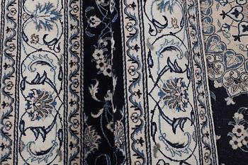 A carpet, Nain, part silk, ca 310 x 205 cm.