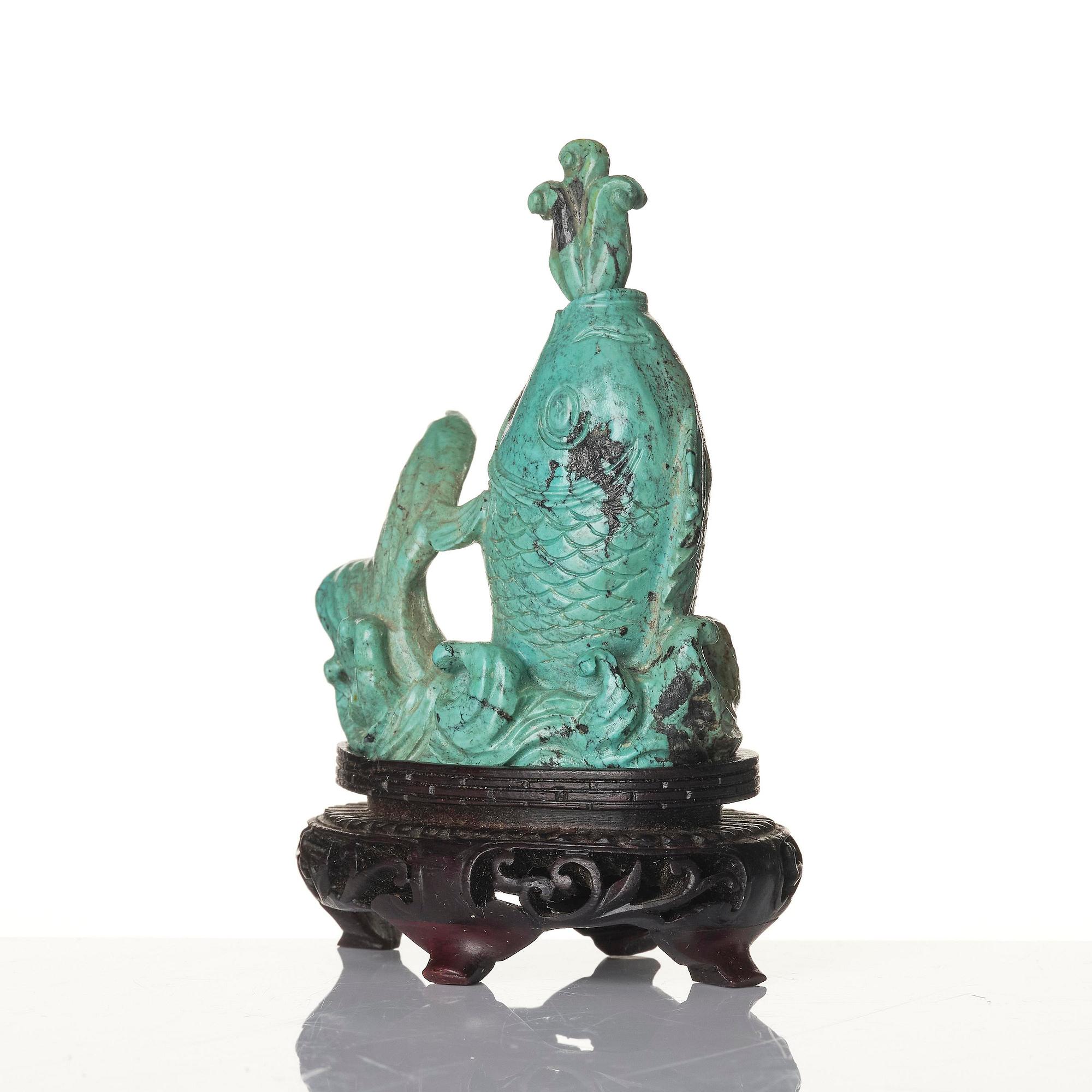 A well sculptured turquoise figure of a carp, Qing dynasty, 19th century.