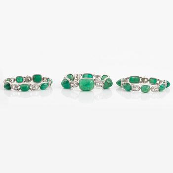 An art deco platinum necklace/bracelet combination with cabochon-cut emeralds.