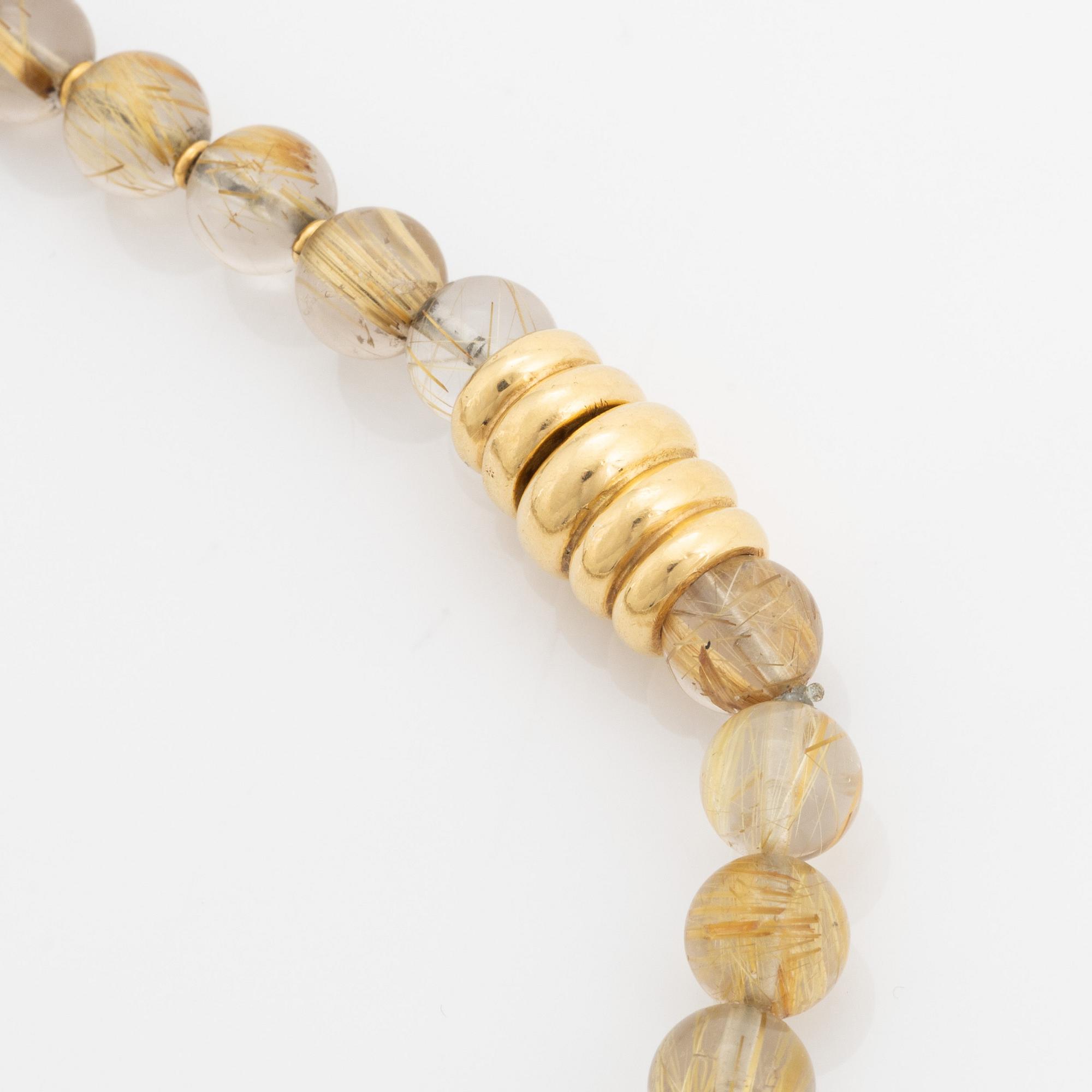 Arne Blomberg, pendant with chain, rutile quartz, gold and diamonds.