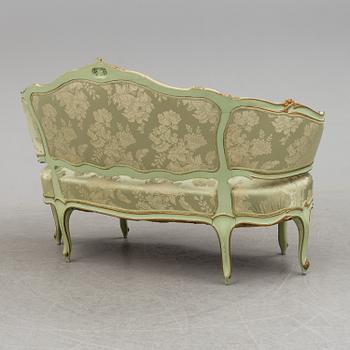 The second half of the 19th century Louis XV-style sofa.