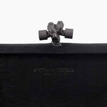 Bottega Veneta, a 'Long Knot' clutch.