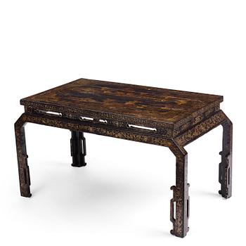 1122. A Chinese painted black lacquer low table, Qing dynasty.