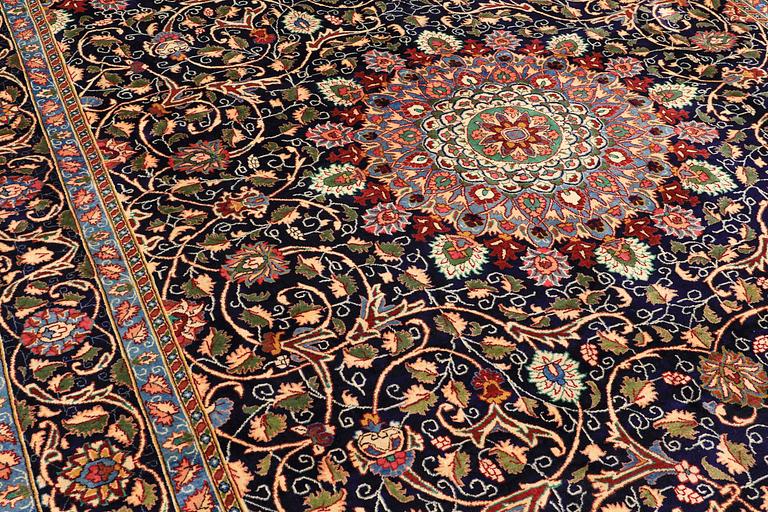 A carpet, Kashmar, signed, ca 390 x 295 cm.