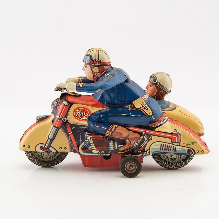Toy motorcycle with sidecar. Huki Germany mid-20th century lithographed tin.