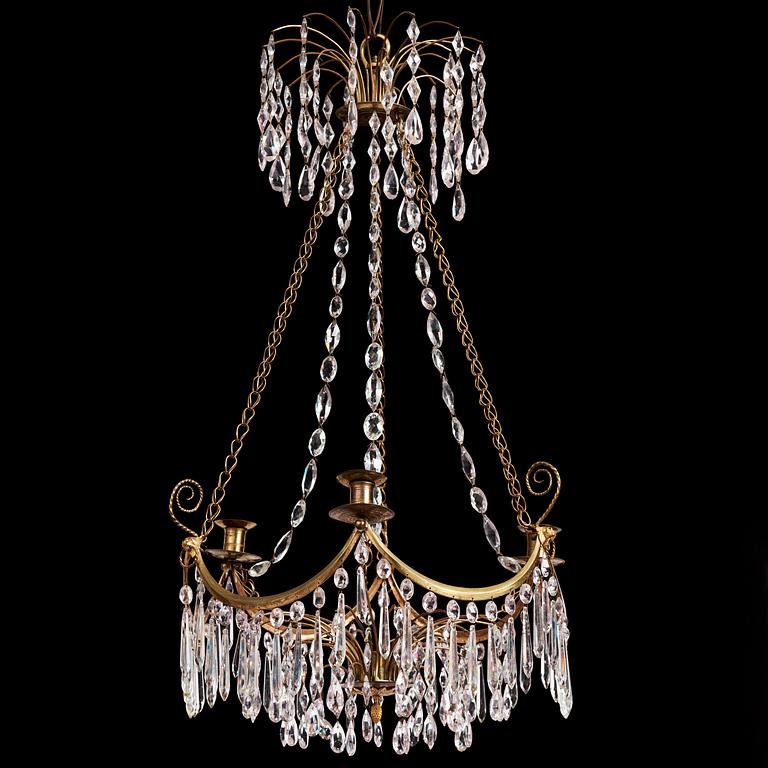 A Gustavian gilt brass and cut glass four-light chandelier, Stockholm, late 18th century.