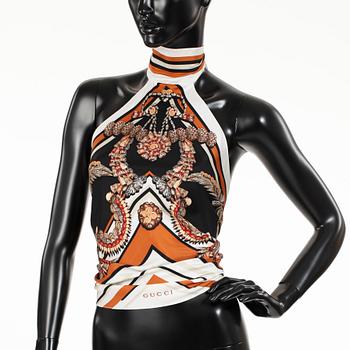 GUCCI, a silk top.