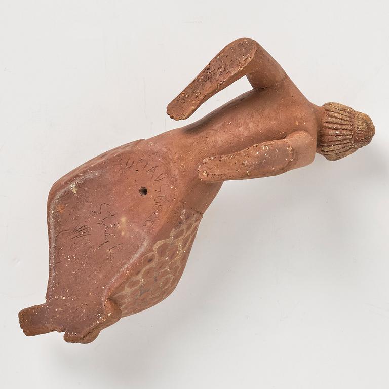 Stig Lindberg, a chamotte stoneware sculpture of a reclining woman, Gustavsberg studio, Sweden mid-20th century.