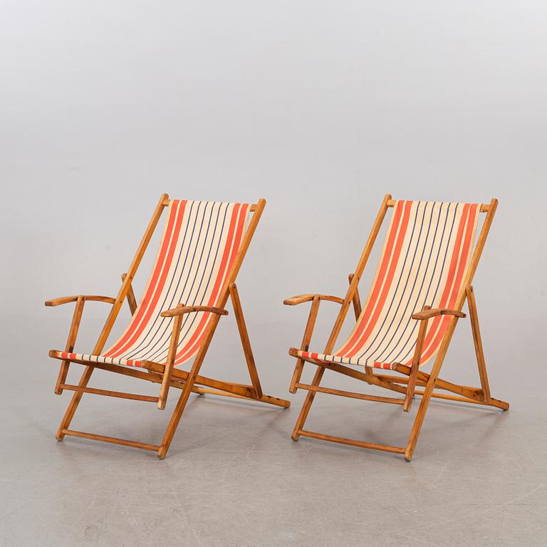 A pair of mid 20th century beach chairs.