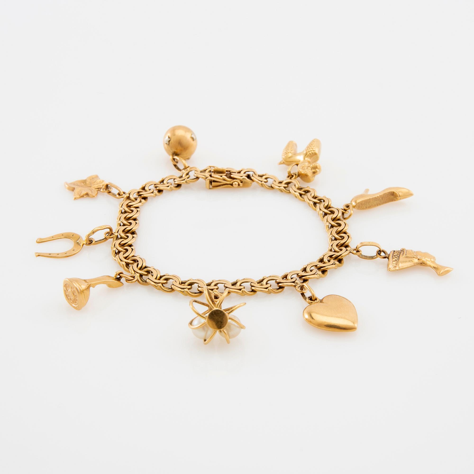 Bracelet Bismarck link 18K gold with charms.