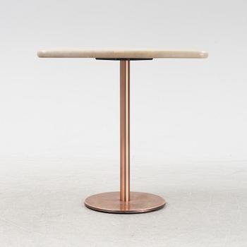 A steel and oak table by Jonas Lindvall 2011.