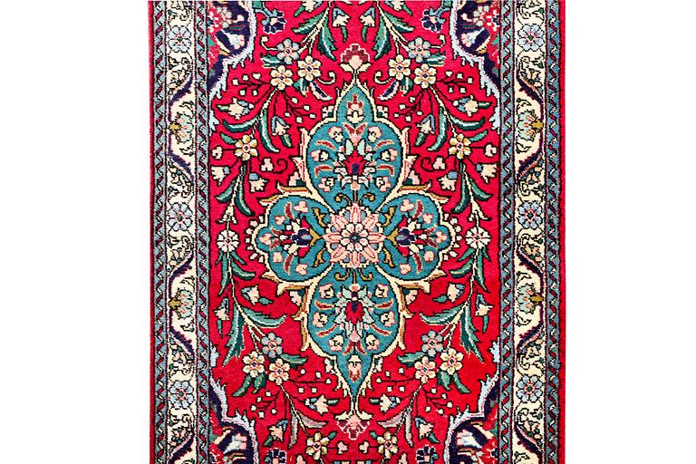 A runner carpet, Tabriz, c. 402 x 88 cm.