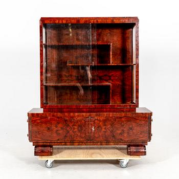 A walnut Art Deco early 1900s display cabinet.