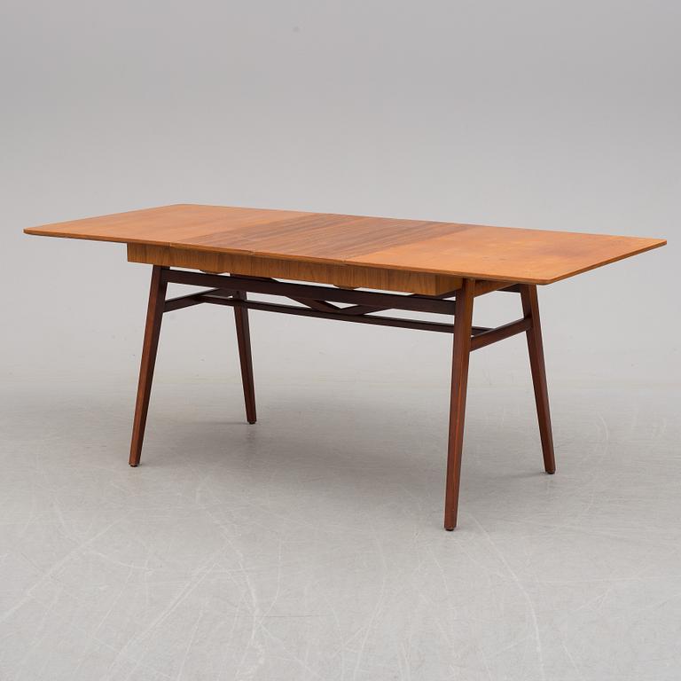 A teak veneered dining table, 1950's/60's.