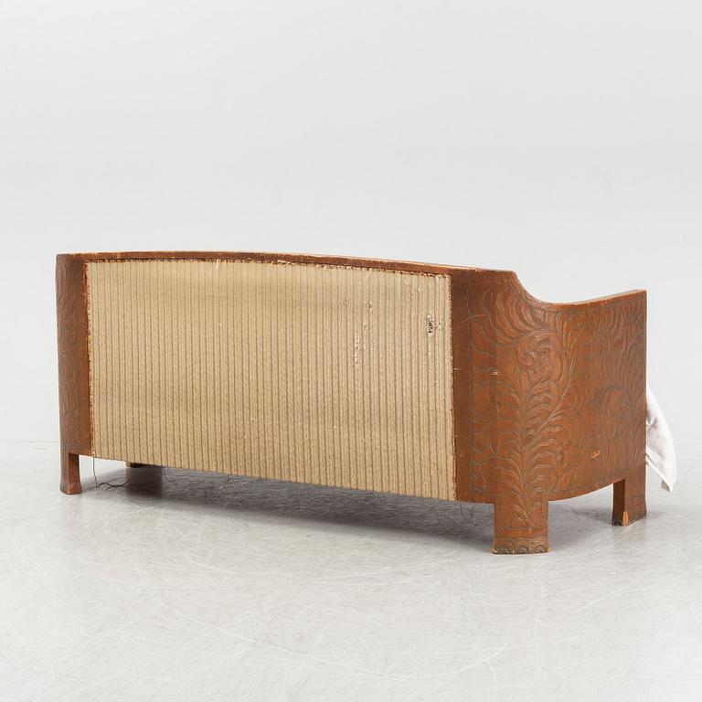 Otto Wretling, attributed to, an Art Nouveau pine sofa, Sweden early 20thC.