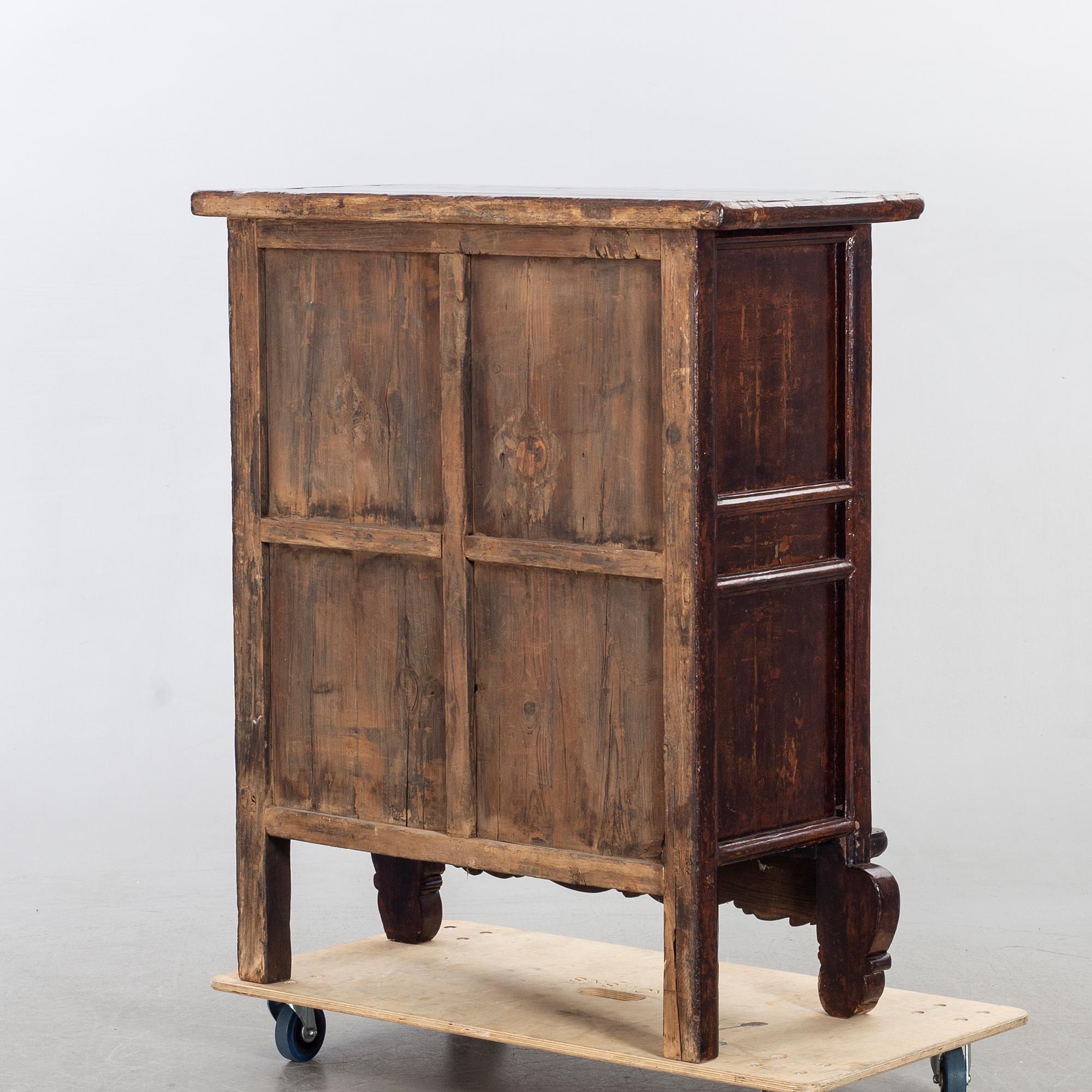 A 19TH CENTURY CHINESE CUPBOARD.
