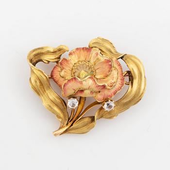 A brooch/necklace combination comprising two brooches and a necklace.