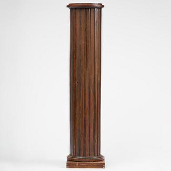 A Swedish Empire column-shaped cabinet, first part 19th century.