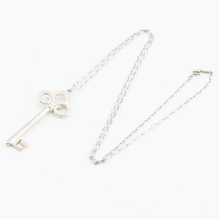 Tiffany & Co, "Fleur de lis key" pendant key with chain, sterling silver.