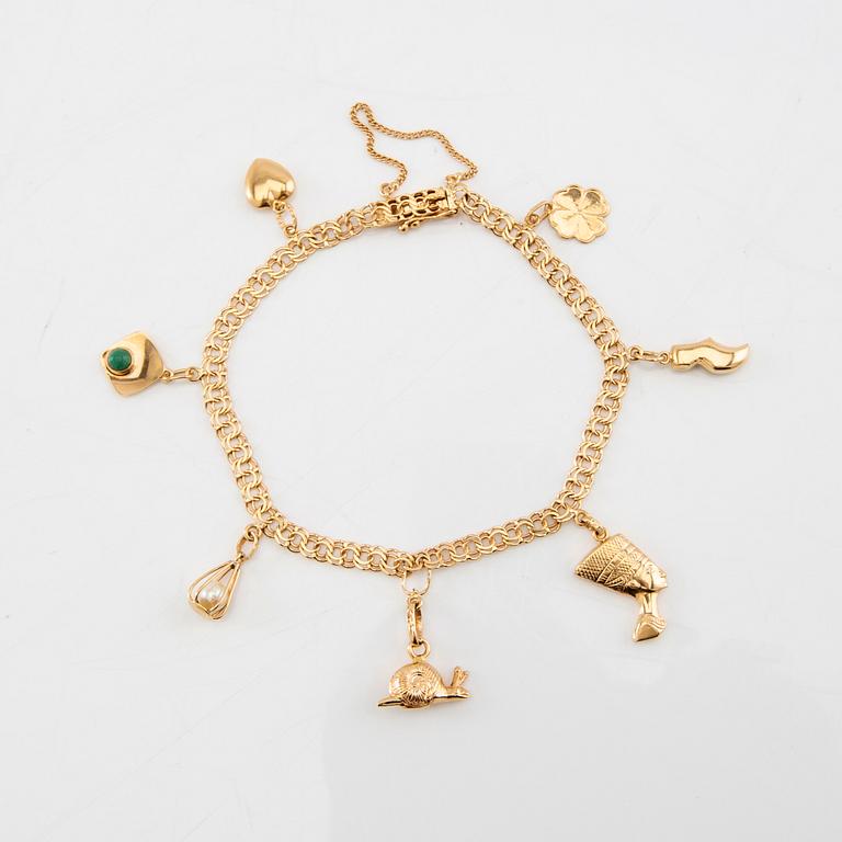 Armband Bismarck-länk 18K guld med berlocker.