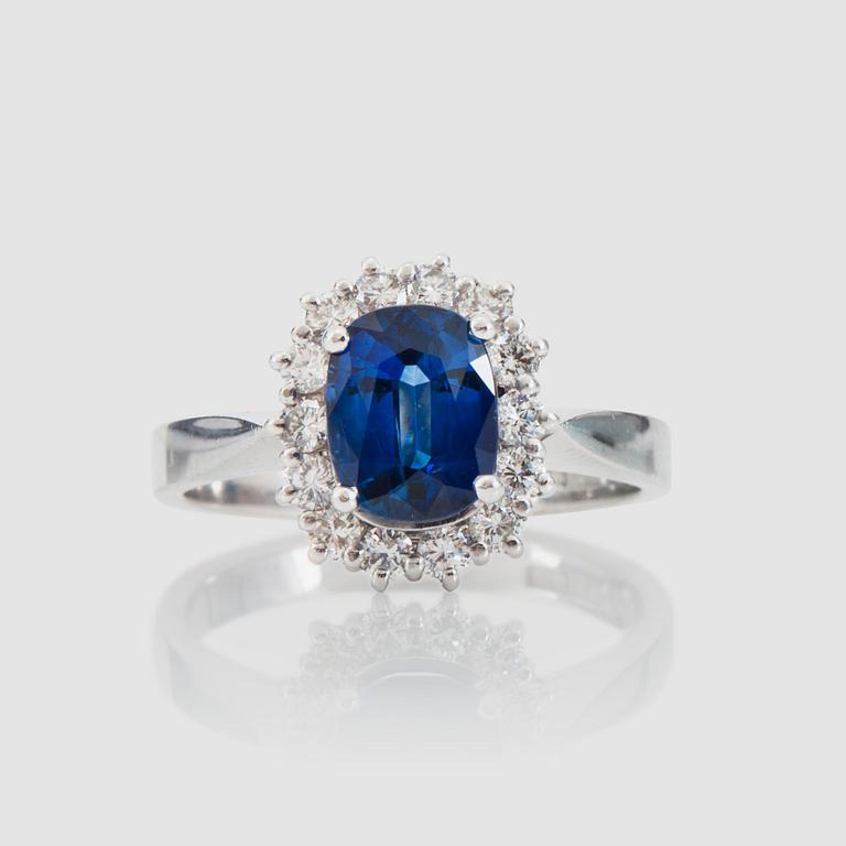A circa 1.72 st sapphire and brilliant-cut diamond ring. Total carat weight of diamonds circa 0.56 ct.