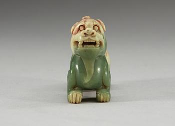 A carved nephrite figure of an archaistic buddhist lion, Qing dynasty.