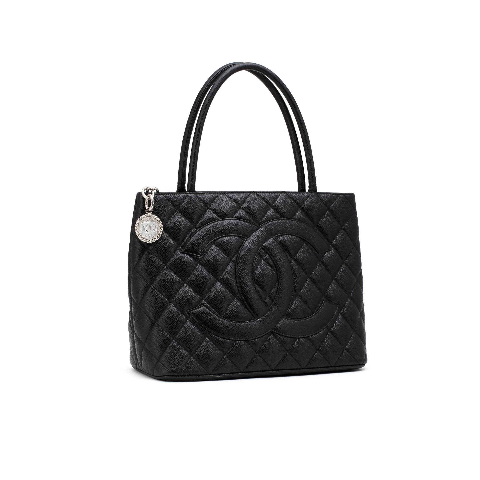 CHANEL, a black leather "Shopping" handbag.