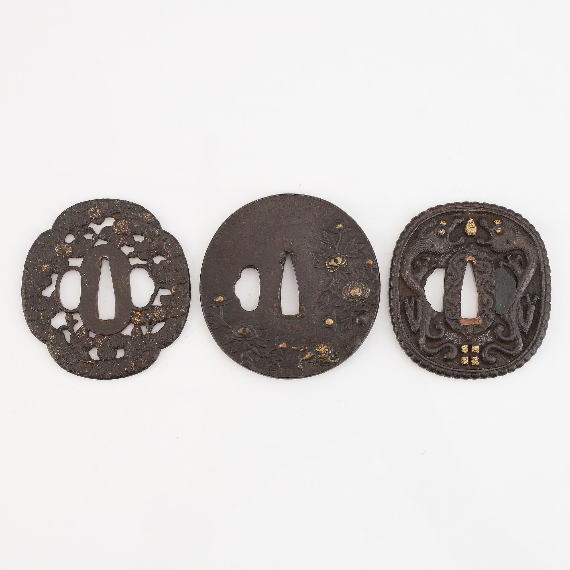 Seven tsuba of different origin, 18th - 20th Century.