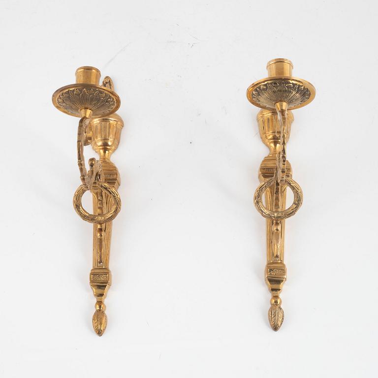 A pair of 'Törne' brass one-light wall ligths from IKEA's 18th Century collection.