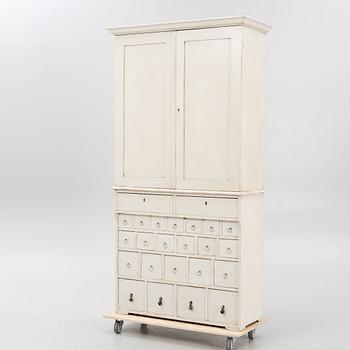 Drawer compartment with overhead cabinet, late 19th Century.