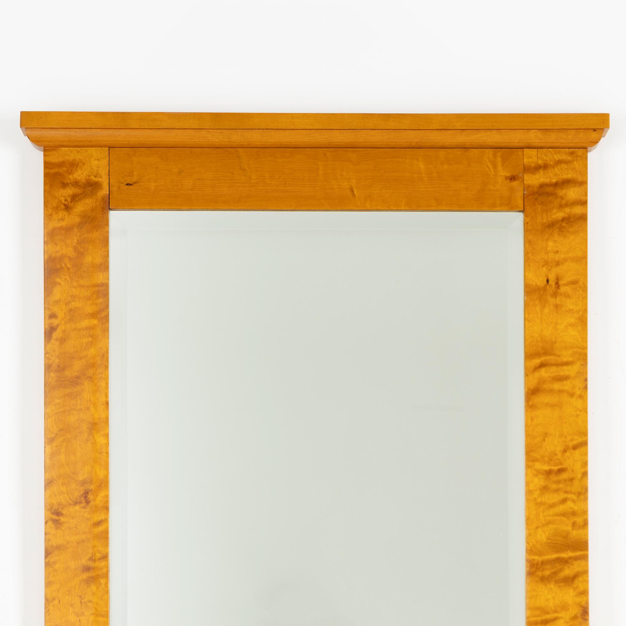 A mirror with console table, early 20th century.