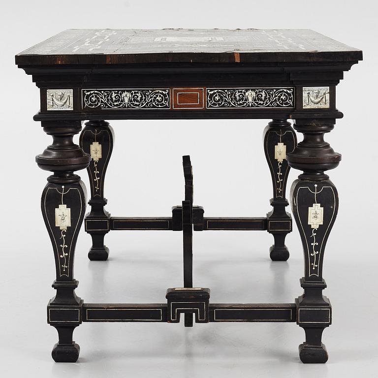 A Renaissance-style ebony, ebonized and ivory-inlaid library table, late 19th century, presumably Germany.