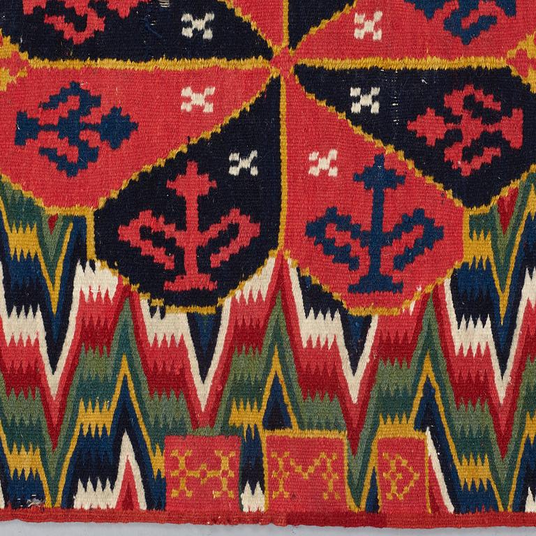 A CARRIAGE CUSHION, "Three rosettes", double interlocked tapestry,  ca 47,5 x 120  cm, signed and dated HMD 1815,