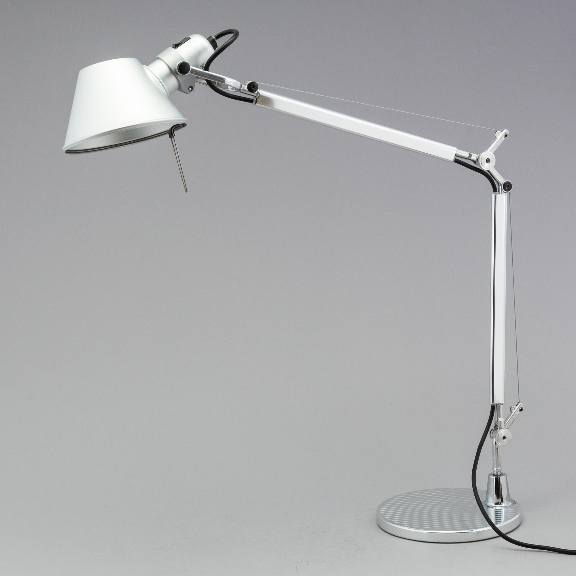 a "Tolomeo mini" table light by Artemide Italy.