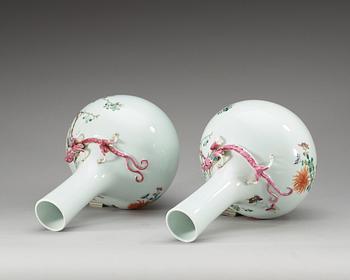 A pair of famille rose vases, first half of 20th Century, with Hongxian four character mark in red.