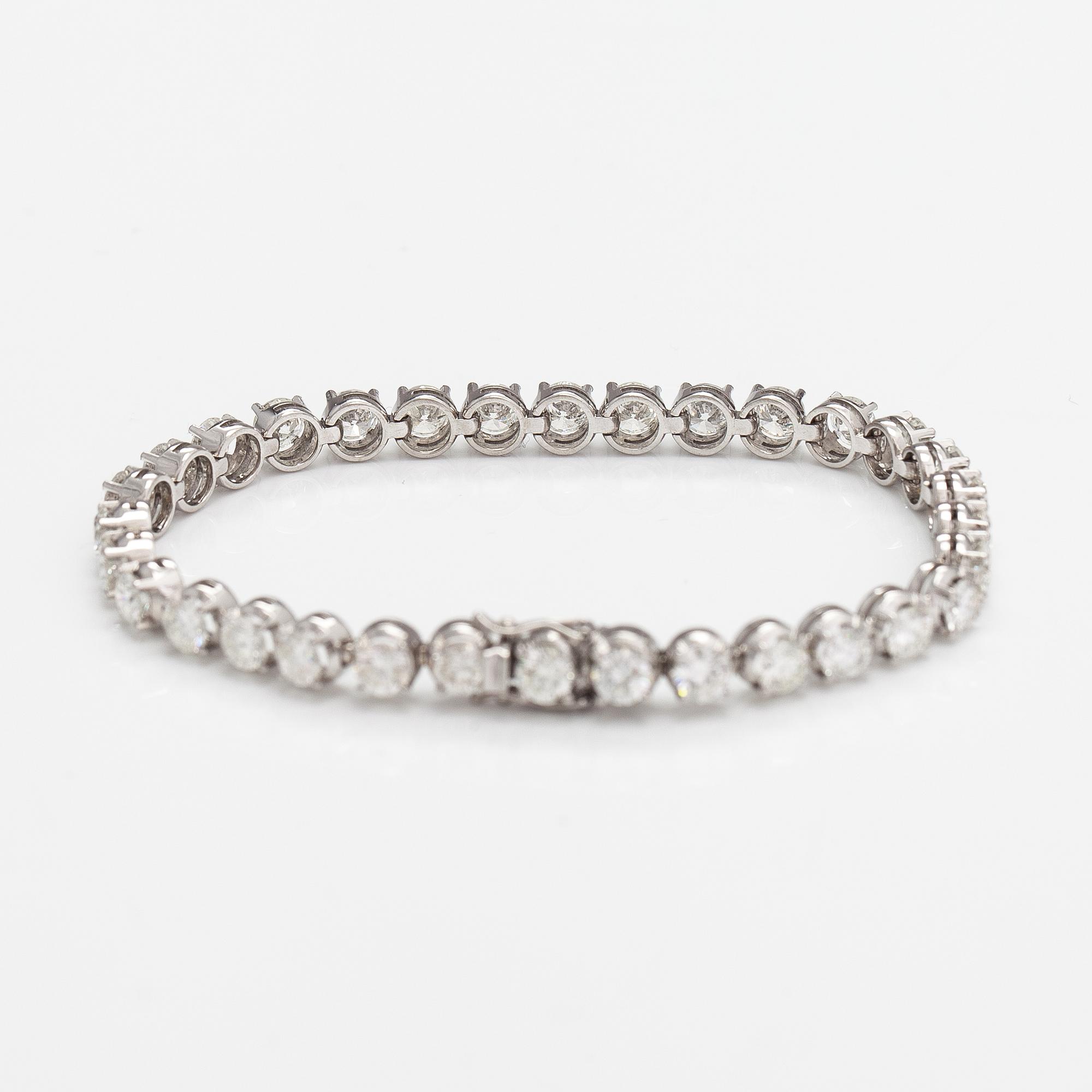 Tennisrannekoru, 18K valkokultaa ja briljanttihiottuja timantteja n. 7.50 ct yht.