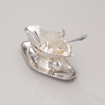 A sauce boat with a sauce ladle in silver, mark of Paul Bang, Copenhagen, Denmark 1929 and 1930s.