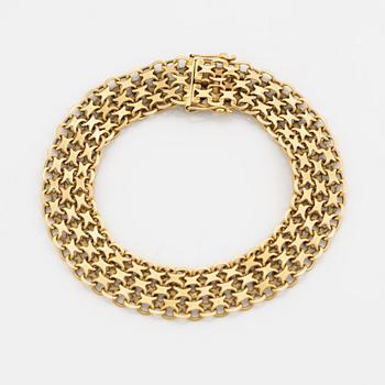 An 18K guld bracelet.