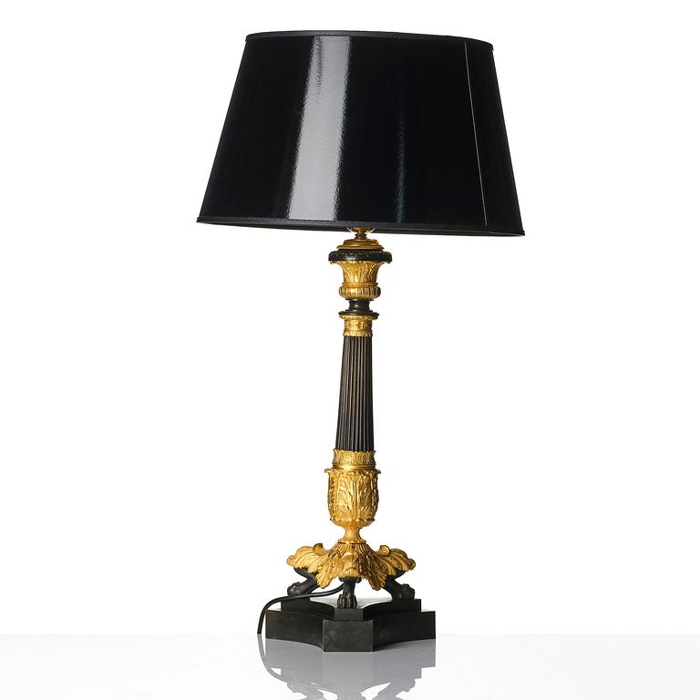 A French Louis Philippe ormolu and patinated bronze lamp, first part 19th century.