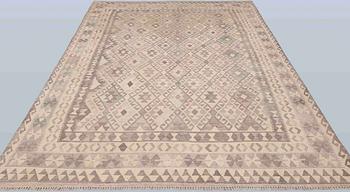 A Kelim carpet, 295 x 210 cm.
