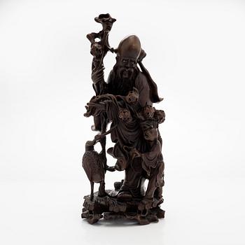 A Chinese carved hardwood figure. Probably 19th century.