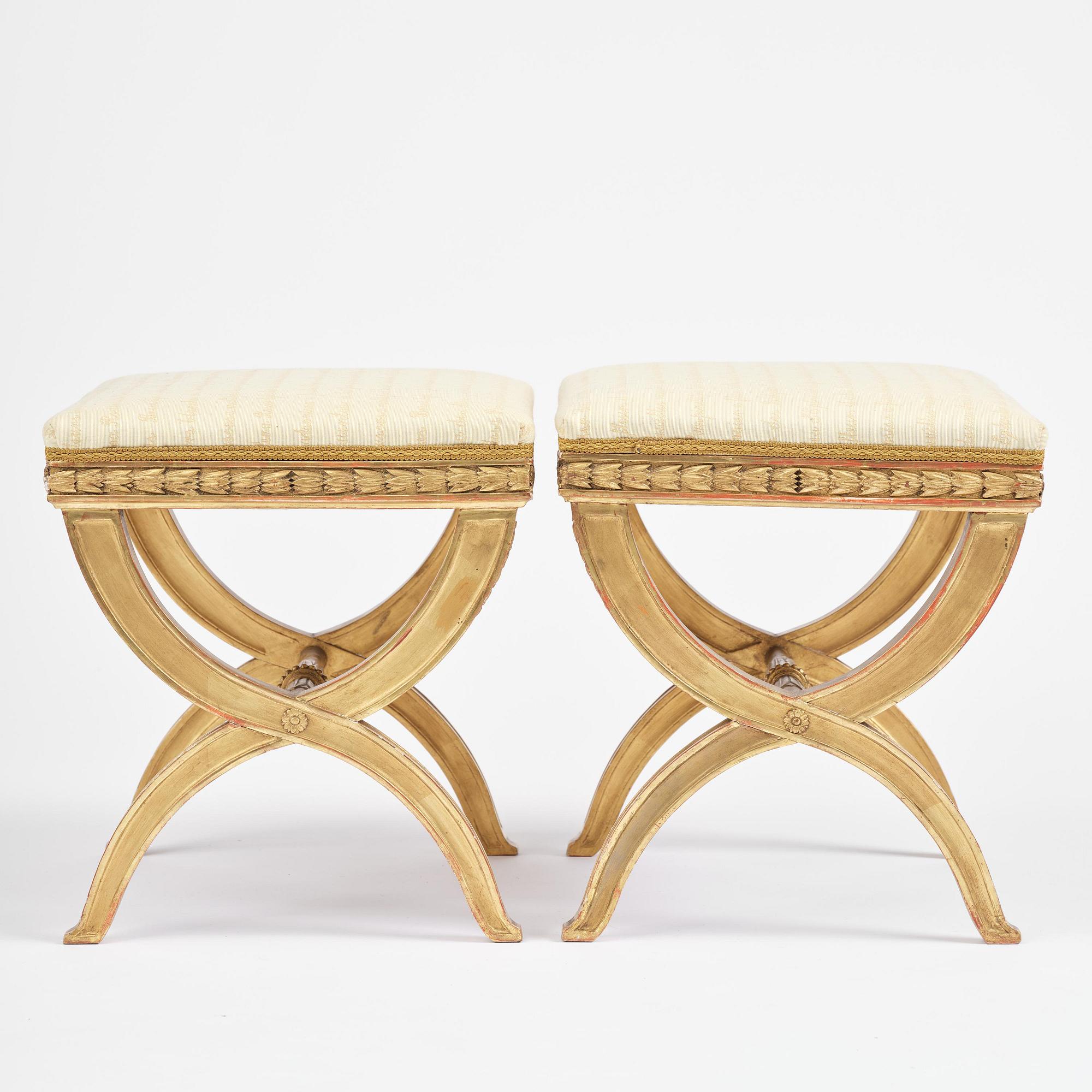 A pair of late Gustavian giltwood stools, Stockholm, late 18th century.