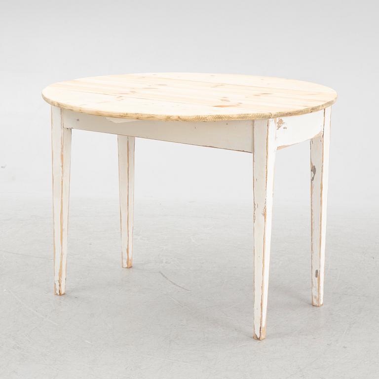 A drop-leaf table, circa 1900.